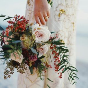 Photo by Natasha Fernandez A bride holding a beautiful floral bouquet, showcasing elegance and tradition on her wedding day.