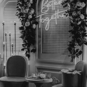 Photo by Taha Samet Arslan Black and white interior design featuring floral decorations and chic furniture.