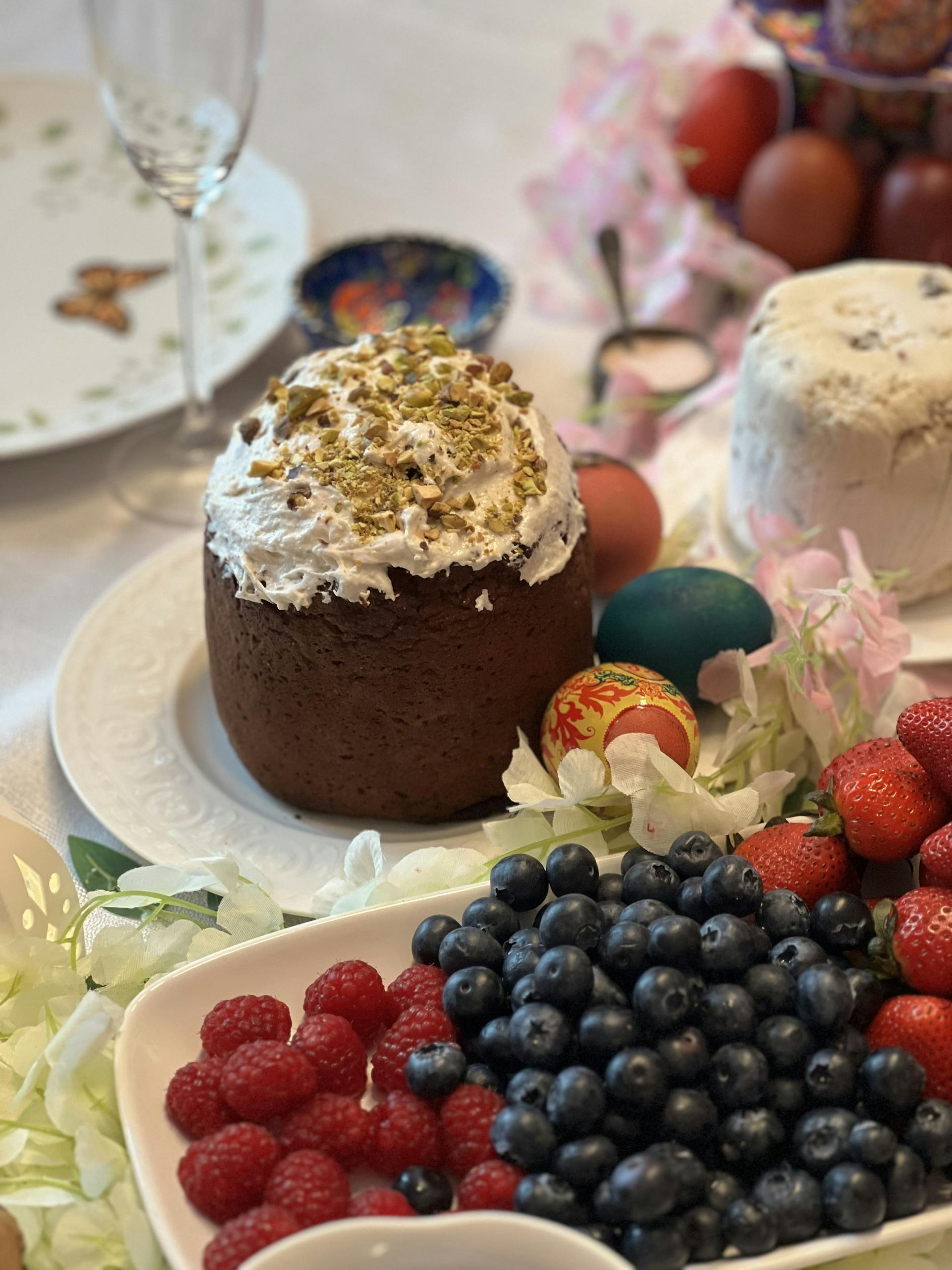 A table with a variety of foods and berries