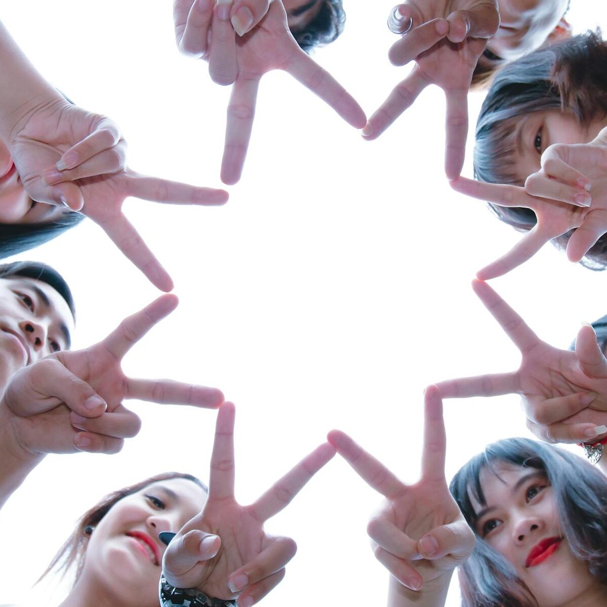 Group of People Forming Star Using Their Hands