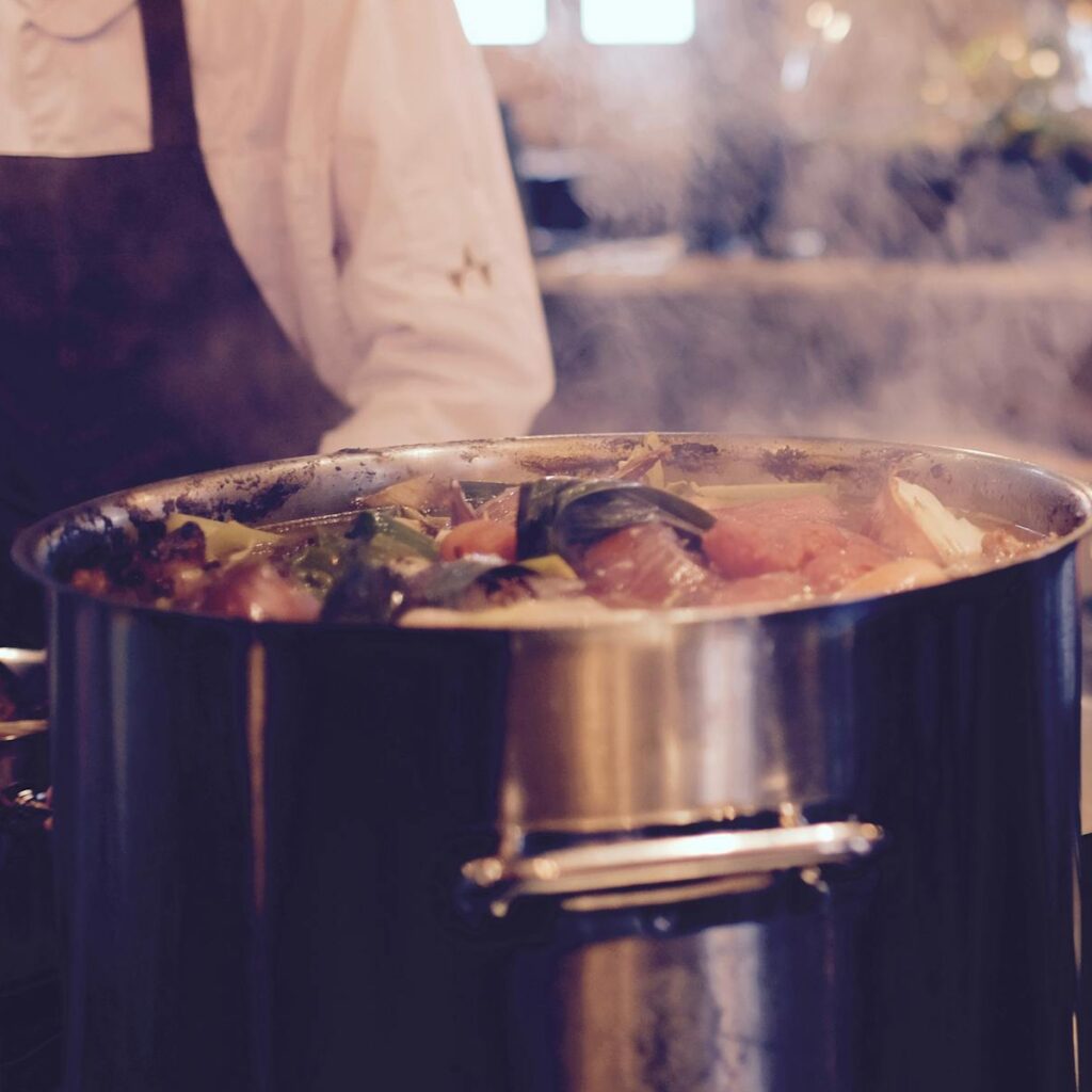 Man Wearing Black Apron Near Two Silver Metal Cooking Pot