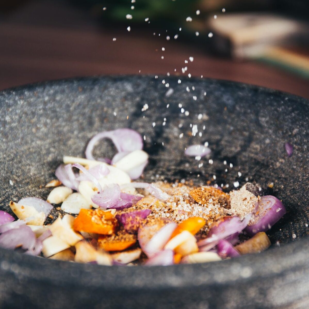 Person Pouring Salt in Bowl