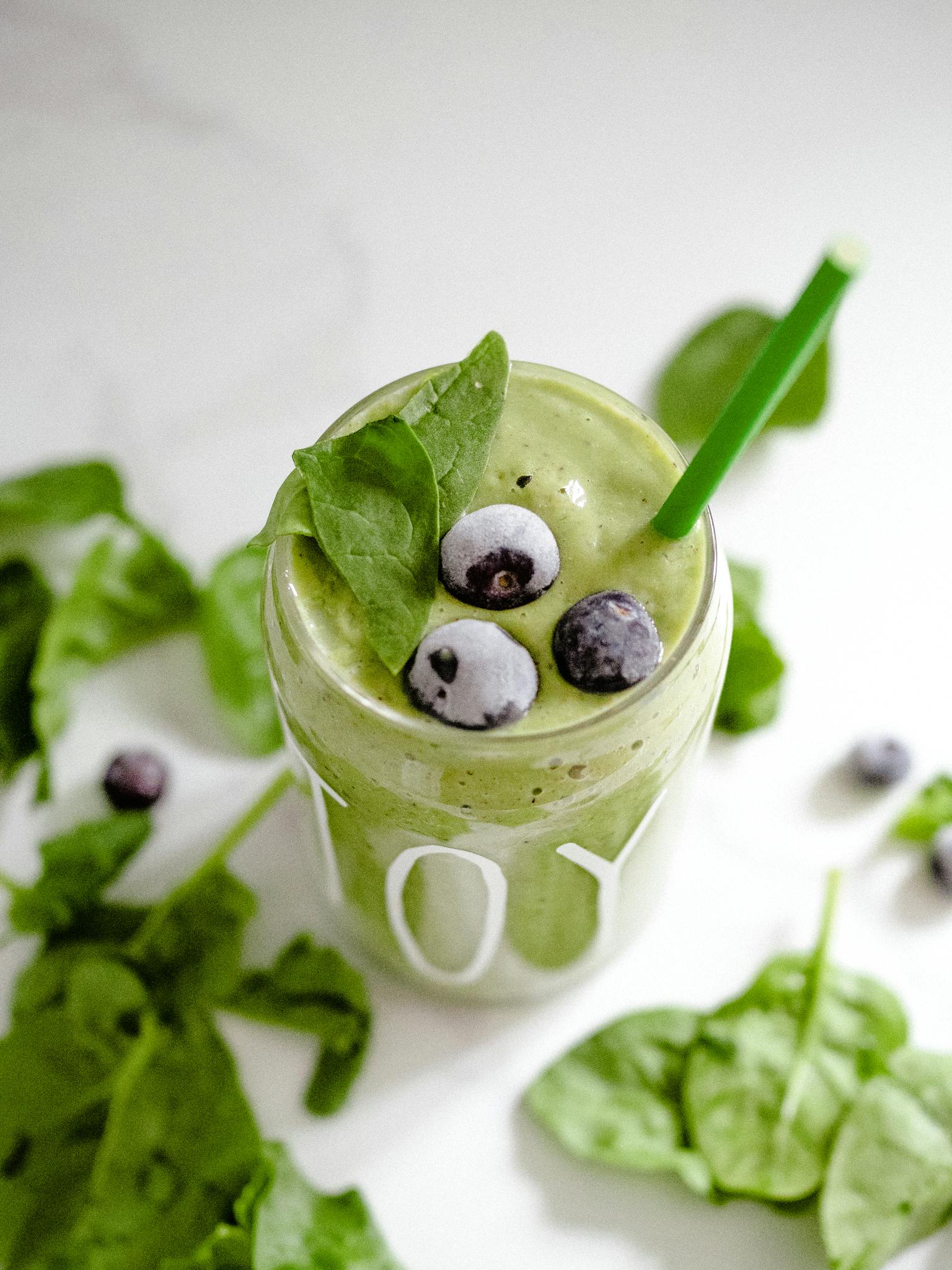 Invigorating green smoothie with spinach and blueberries, perfect for a healthy boost.