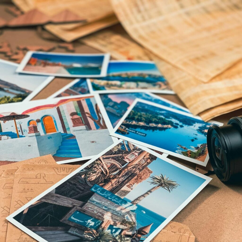 A collection of travel photos alongside a Canon camera, symbolizing adventure and creativity.