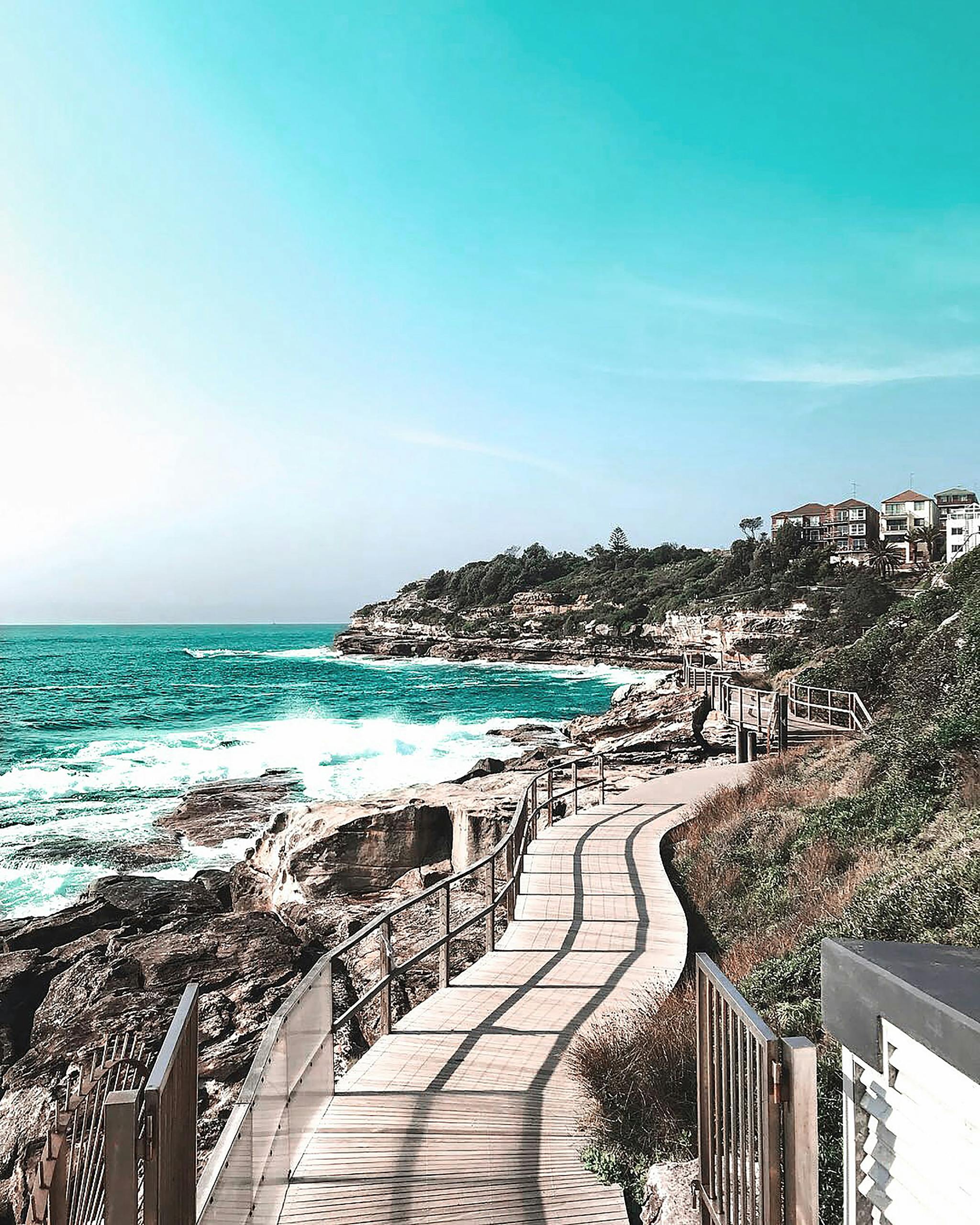 A picturesque coastal pathway along Bondi Beach, capturing the vibrant sea and sky.