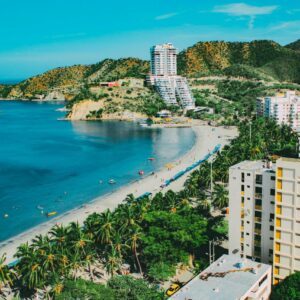 A breathtaking aerial view of Santa Marta's beachfront, showcasing a blend of nature and modern architecture.