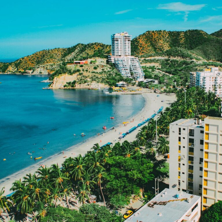 A breathtaking aerial view of Santa Marta's beachfront, showcasing a blend of nature and modern architecture.