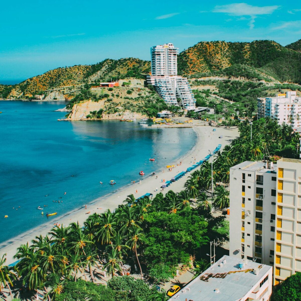 A breathtaking aerial view of Santa Marta's beachfront, showcasing a blend of nature and modern architecture.