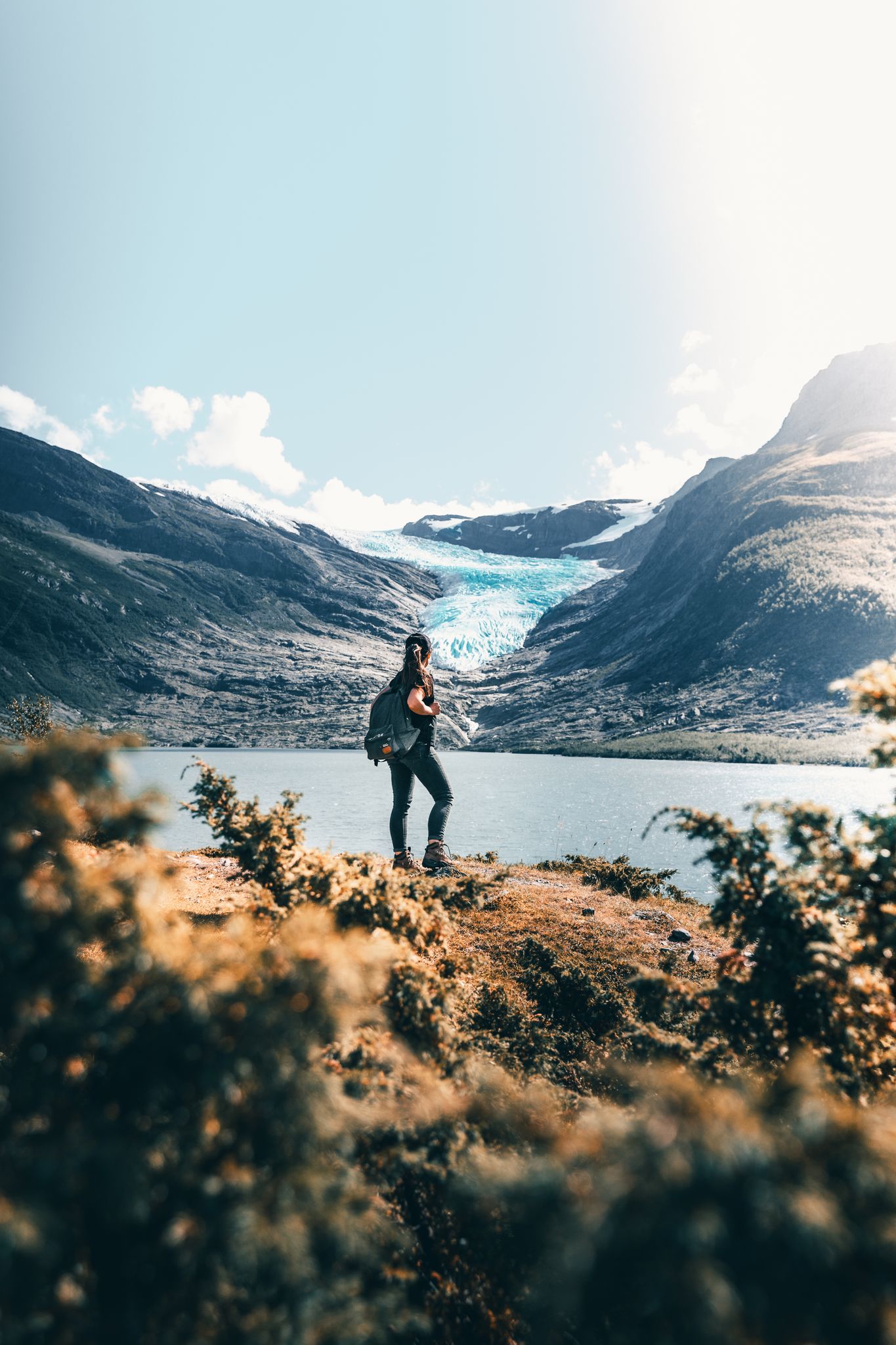 Explore the breathtaking Nordland landscape with a hiker at the scenic lake and mountains.