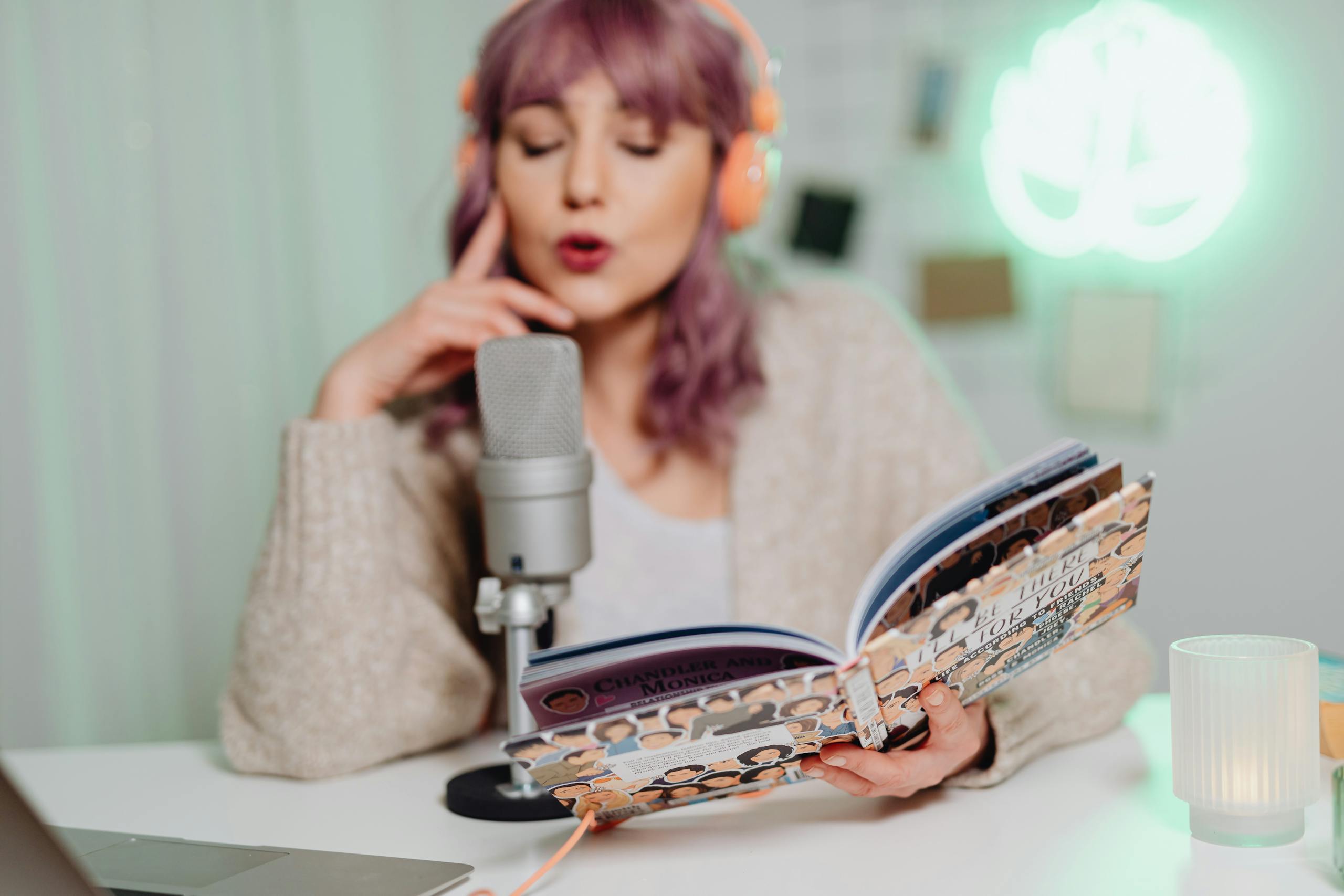 Woman in Brown Sweater Holding a Book